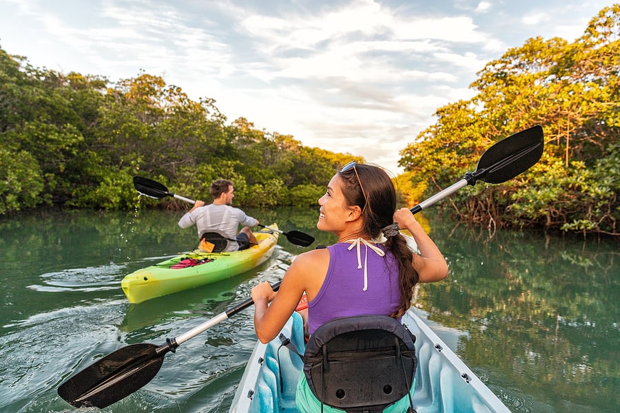 bigstock-Couple-kayaking-together-in-ma-286586047