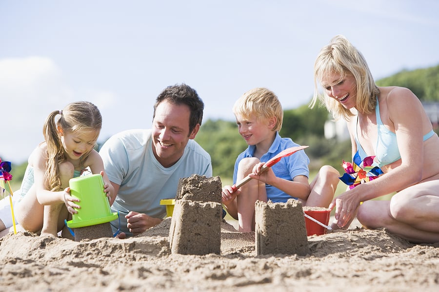 bigstock-Families-On-Beach-Making-Sand--4136382