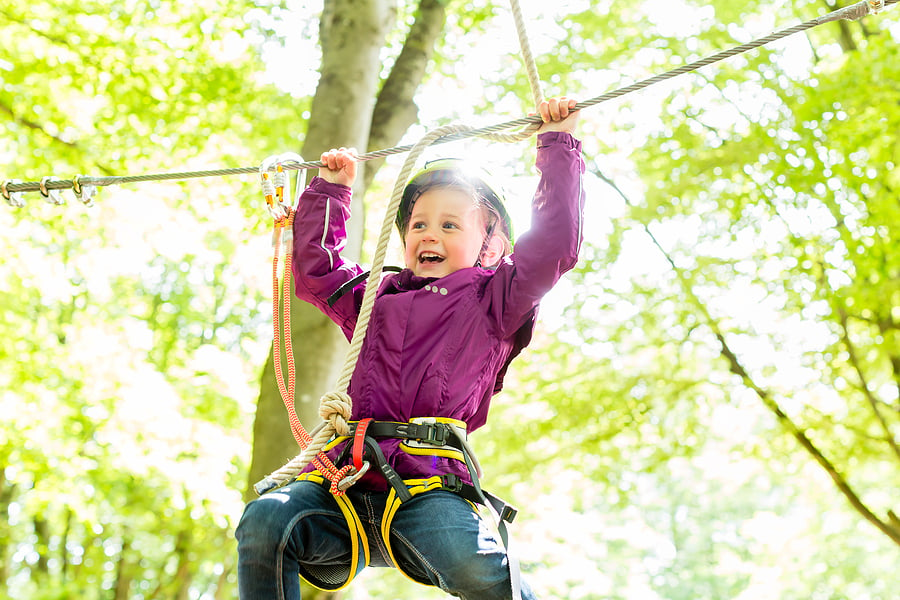 bigstock-Girl-climbing-in-high-rope-cou-184701637